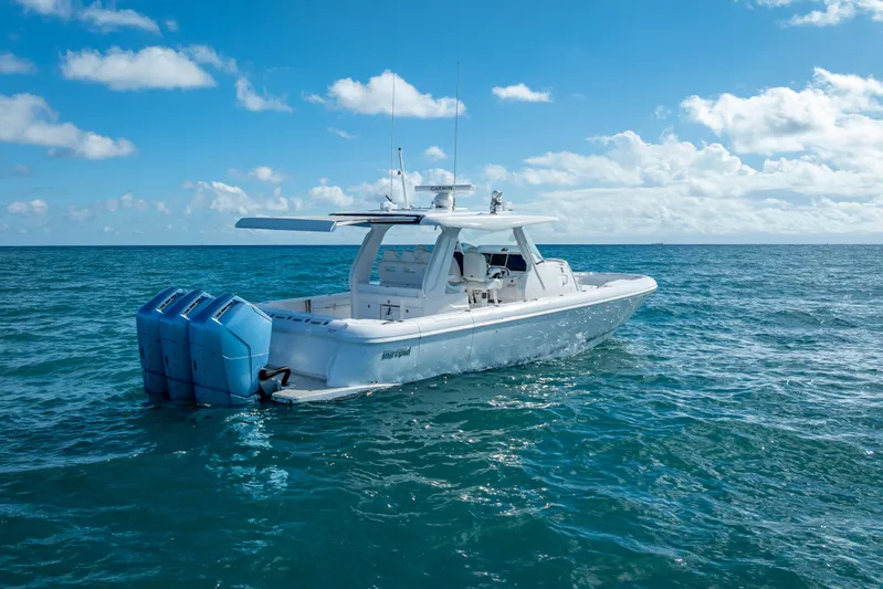  Yacht Photos Pics 2023 Intrepid 427 Nomad SE boat on open ocean under blue sky.