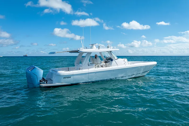  Yacht Photos Pics 2023 Intrepid 427 Nomad SE boat cruising on open ocean under blue sky.