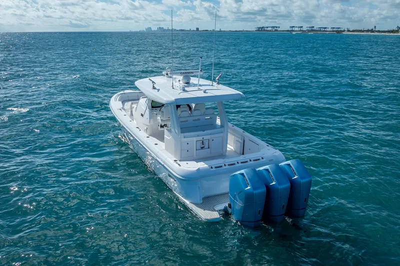  Yacht Photos Pics 2023 Intrepid 427 Nomad SE boat cruising on open ocean waters.