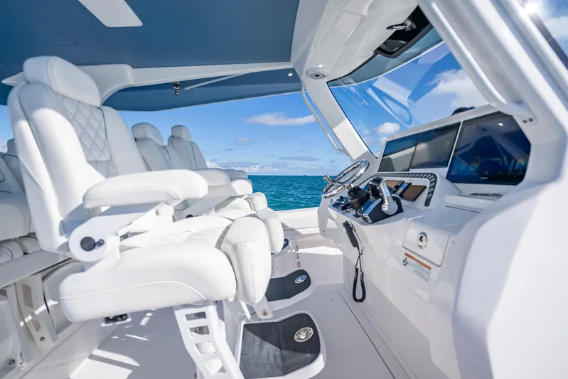  Yacht Photos Pics Luxurious interior of 2023 Intrepid 427 Nomad SE boat with ocean view.
