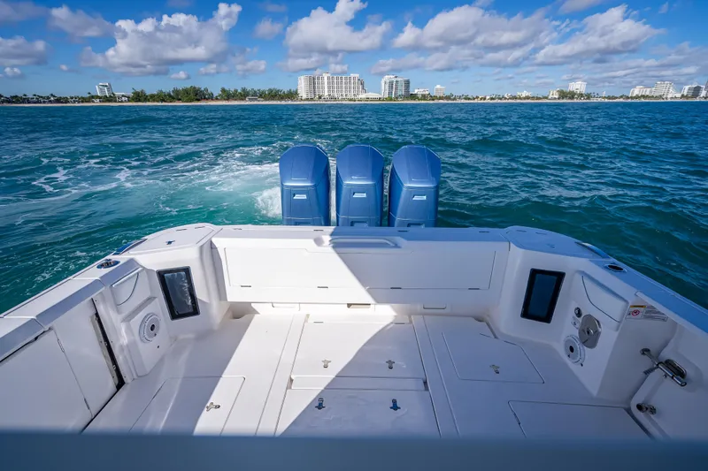  Yacht Photos Pics 2023 Intrepid 427 Nomad SE boat with triple engines on open water.