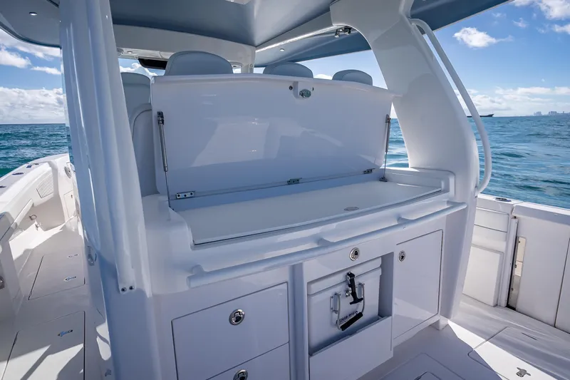  Yacht Photos Pics 2023 Intrepid 427 Nomad SE boat interior with sleek design and ocean view.