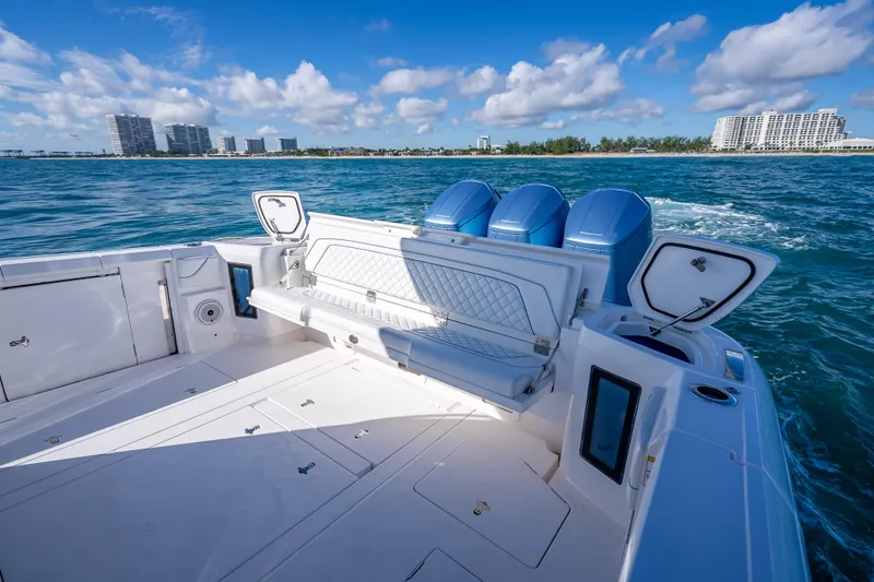  Yacht Photos Pics 2023 Intrepid 427 Nomad SE boat with triple engines on open water.