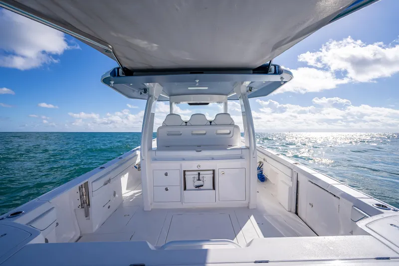  Yacht Photos Pics 2023 Intrepid 427 Nomad SE boat on open sea under clear blue sky.
