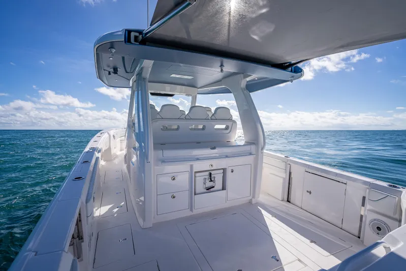  Yacht Photos Pics 2023 Intrepid 427 Nomad SE boat on open sea under clear blue sky.