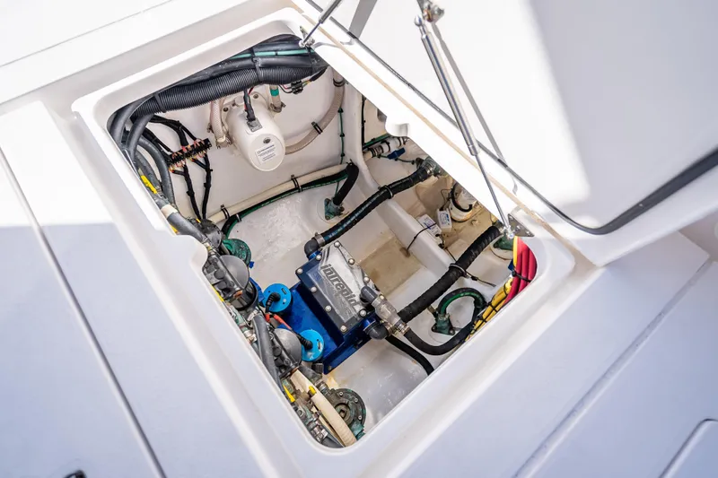 Yacht Photos Pics Engine compartment of 2023 Intrepid 427 Nomad SE, showcasing internal components and wiring.