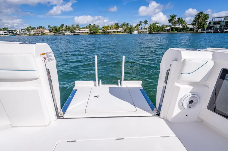  Yacht Photos Pics 2023 Intrepid 427 Nomad SE boat deck with scenic waterfront view.