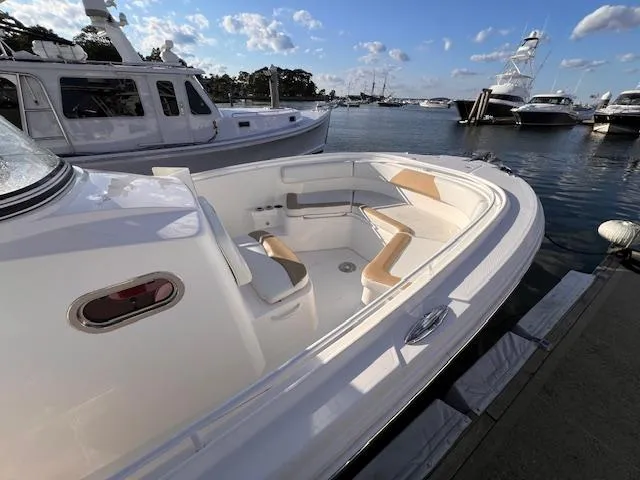 Johnny B' Good Yacht Photos Pics 2015 Edgewater 280CC boat docked, featuring spacious seating and sleek design.