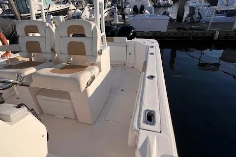 Johnny B' Good Yacht Photos Pics Edgewater 280CC 2015 boat interior with seating, docked at marina.