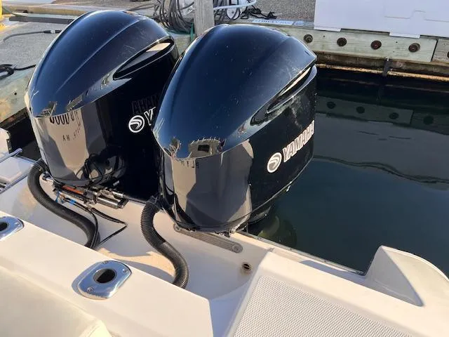 Johnny B' Good Yacht Photos Pics Twin Yamaha outboard engines on a 2015 Edgewater 280CC boat at the dock.