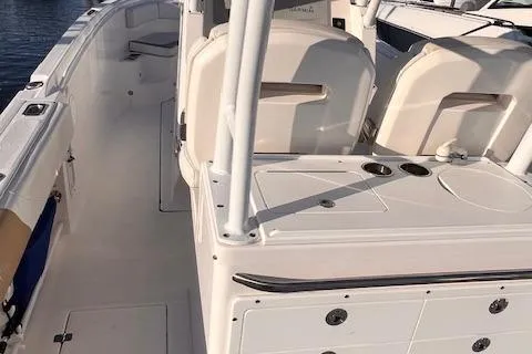 Johnny B' Good Yacht Photos Pics 2015 Edgewater 280CC boat interior with seating and storage compartments.