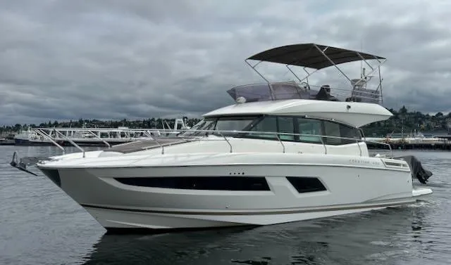 R & R Yacht Photos Pics 2015 Prestige 420 yacht on calm water under cloudy skies.