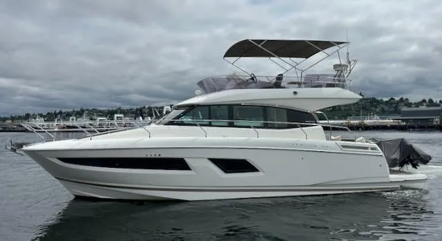 R & R Yacht Photos Pics 2015 Prestige 420 yacht on calm water under cloudy skies.
