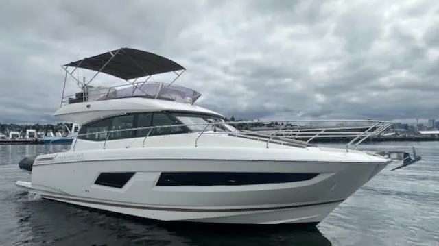 R & R Yacht Photos Pics 2015 Prestige 420 yacht on calm water under cloudy skies.