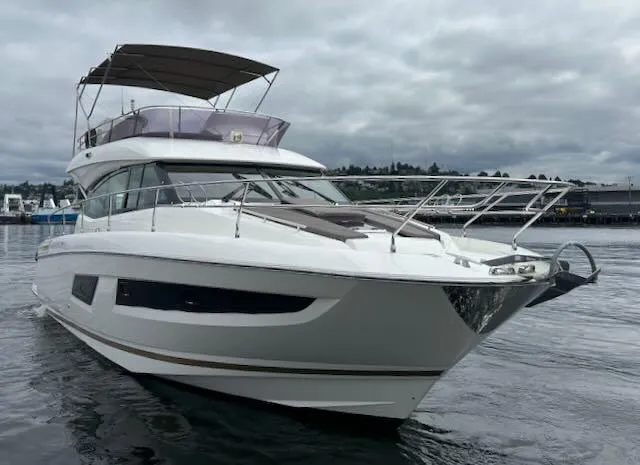 R & R Yacht Photos Pics 2015 Prestige 420 yacht on water under cloudy sky.