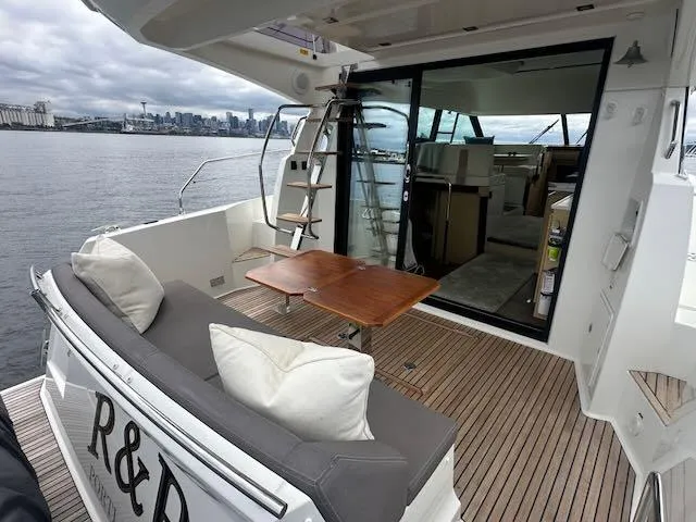 R & R Yacht Photos Pics Luxurious 2015 Prestige 420 yacht with spacious deck and city skyline view.