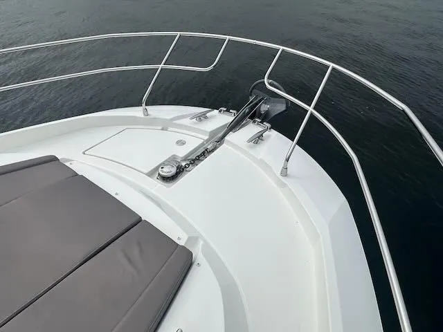 R & R Yacht Photos Pics Bow of 2015 Prestige 420 yacht with sleek railing and anchor system.