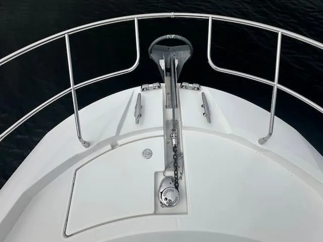 R & R Yacht Photos Pics Bow of 2015 Prestige 420 yacht with anchor and railing.