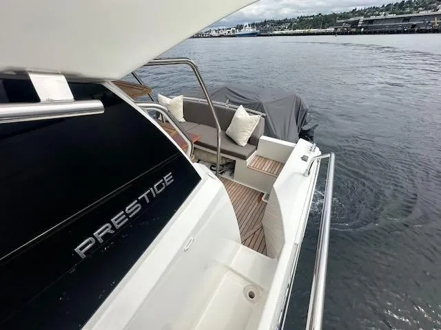 R & R Yacht Photos Pics Luxury 2015 Prestige 420 yacht with elegant deck seating on calm waters.