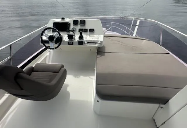 R & R Yacht Photos Pics Flybridge of 2015 Prestige 420 yacht with helm and seating area.