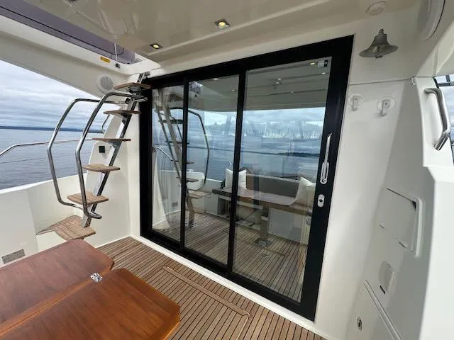 R & R Yacht Photos Pics Prestige 420 yacht interior with sliding glass doors and wooden deck, 2015 model.