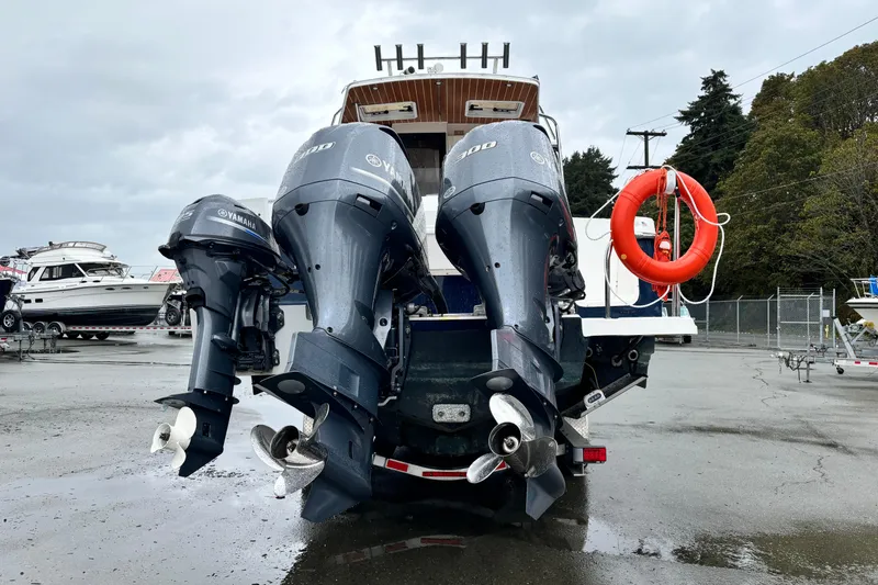  Yacht Photos Pics 2019 Cutwater C-302 Coupe with Yamaha outboard engines in a marina setting.