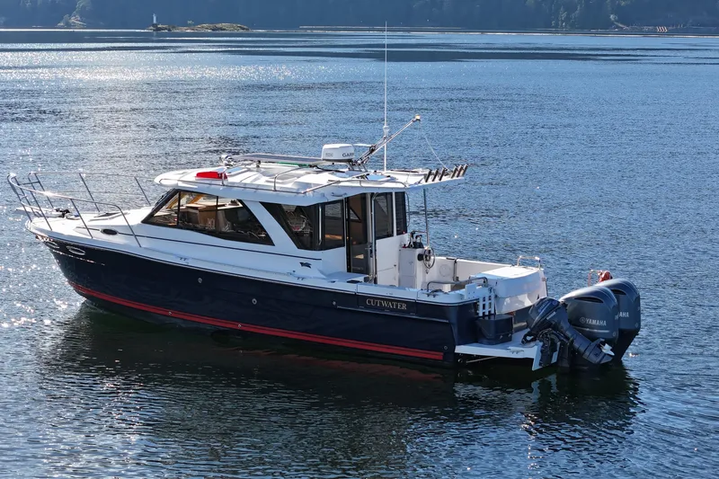  Yacht Photos Pics 2019 Cutwater C-302 Coupe boat on calm water, featuring dual Yamaha engines.
