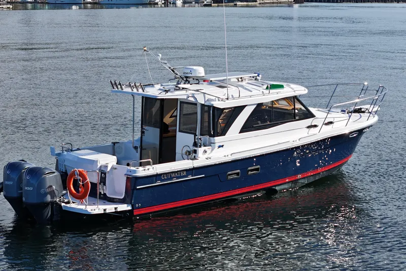  Yacht Photos Pics 2019 Cutwater C-302 Coupe boat on calm water, featuring dual Yamaha engines.