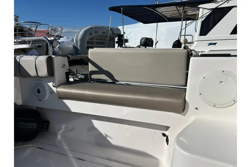  Yacht Photos Pics 2019 Cutwater C-302 Coupe boat interior with beige seating and speaker.