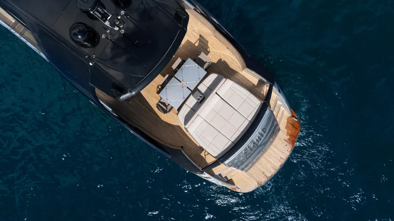 "liquid" Yacht Photos Pics Aerial view of 2020 Pershing 70 yacht on blue ocean water.