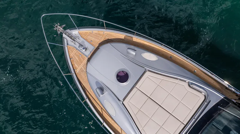 "liquid" Yacht Photos Pics Top view of 2020 Pershing 70 yacht's deck on blue water.
