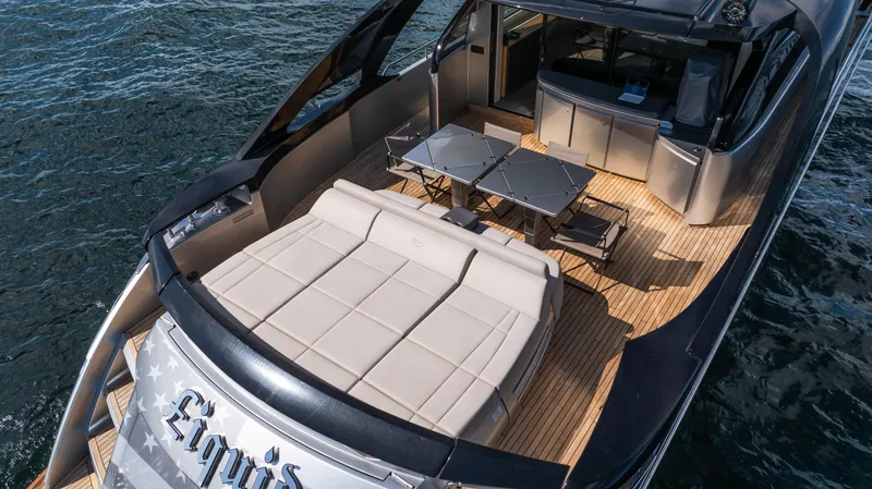 "liquid" Yacht Photos Pics Luxury 2020 Pershing 70 yacht with spacious deck and elegant seating area.