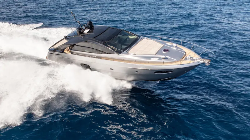 "liquid" Yacht Photos Pics Luxury 2020 Pershing 70 yacht cruising swiftly on open blue sea.