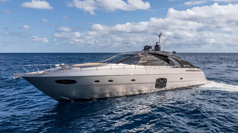 "liquid" Yacht Photos Pics 2020 Pershing 70 yacht cruising on open sea under a partly cloudy sky.