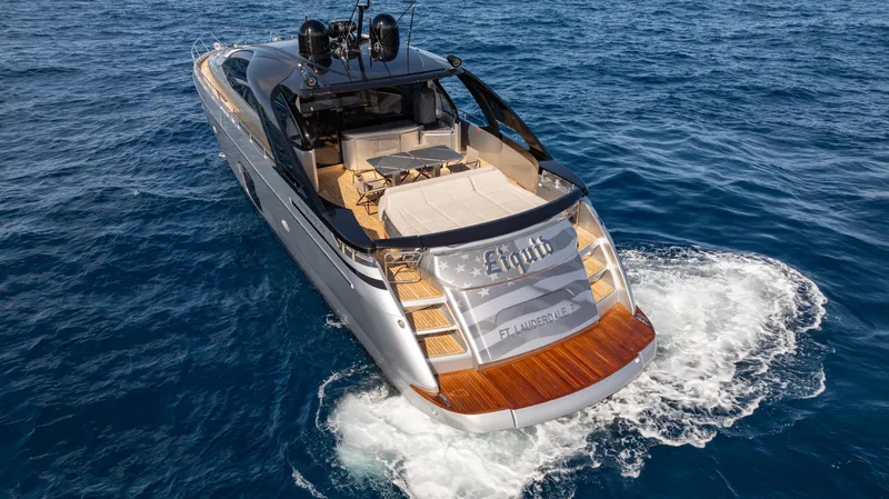 "liquid" Yacht Photos Pics Luxury 2020 Pershing 70 yacht cruising on open sea, showcasing sleek design and elegance.