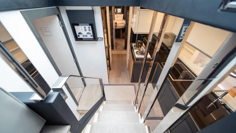 "liquid" Yacht Photos Pics Interior view of a 2020 Pershing 70 yacht, featuring modern design and sleek finishes.