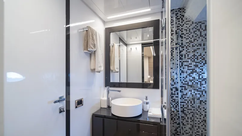 "liquid" Yacht Photos Pics Luxurious bathroom in 2020 Pershing 70 yacht with modern fixtures and mosaic tiles.