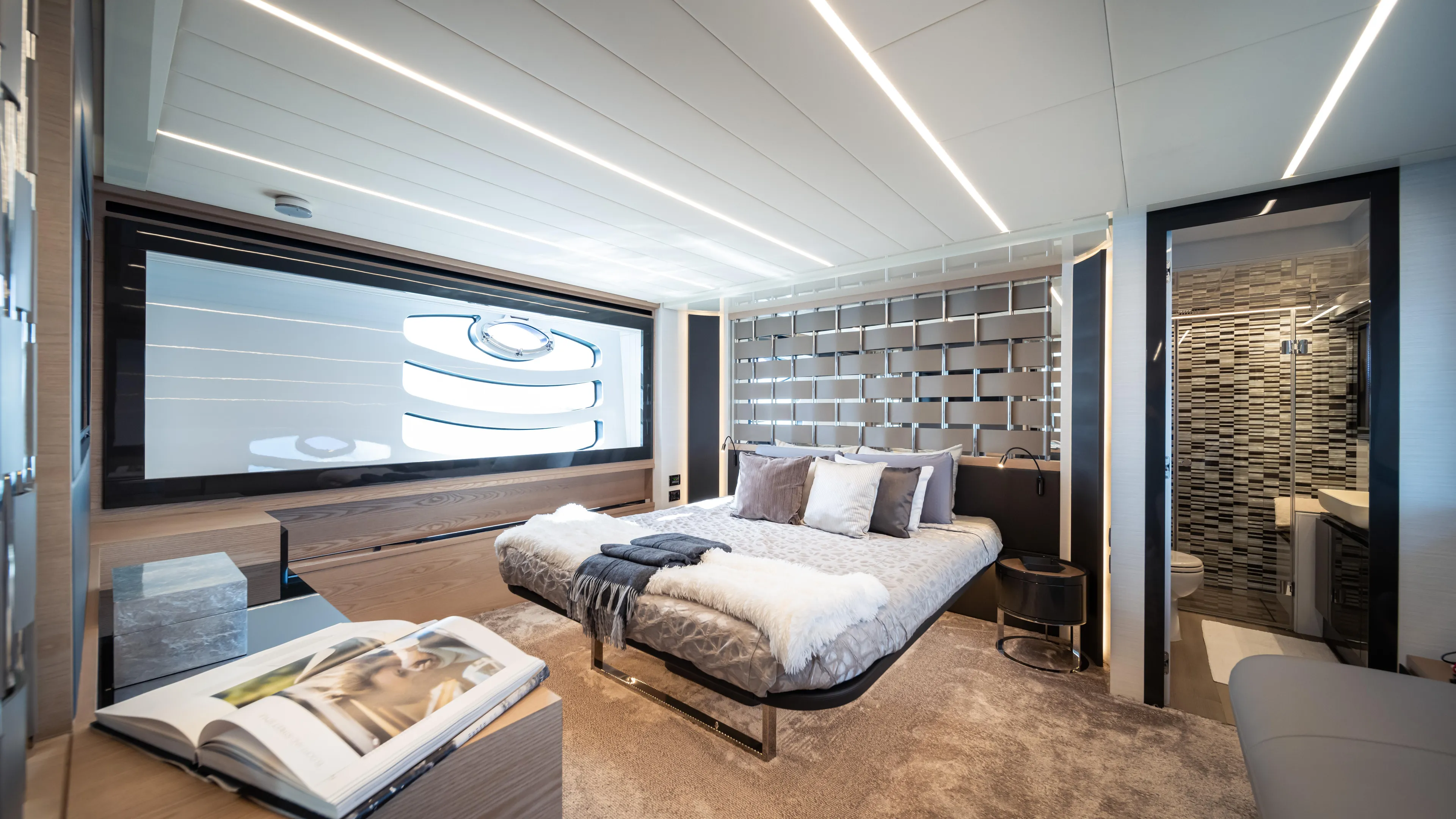 "liquid" Yacht Photos Pics Luxurious bedroom interior of 2020 Pershing 70 yacht with modern design and elegant decor.