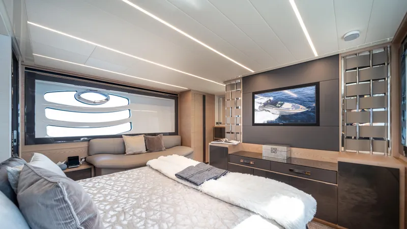 "liquid" Yacht Photos Pics Luxurious interior of 2020 Pershing 70 yacht with modern design and large window.