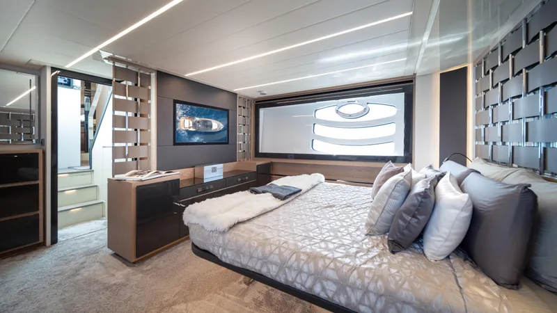 "liquid" Yacht Photos Pics Luxurious interior of 2020 Pershing 70 yacht featuring modern bedroom design and elegant decor.