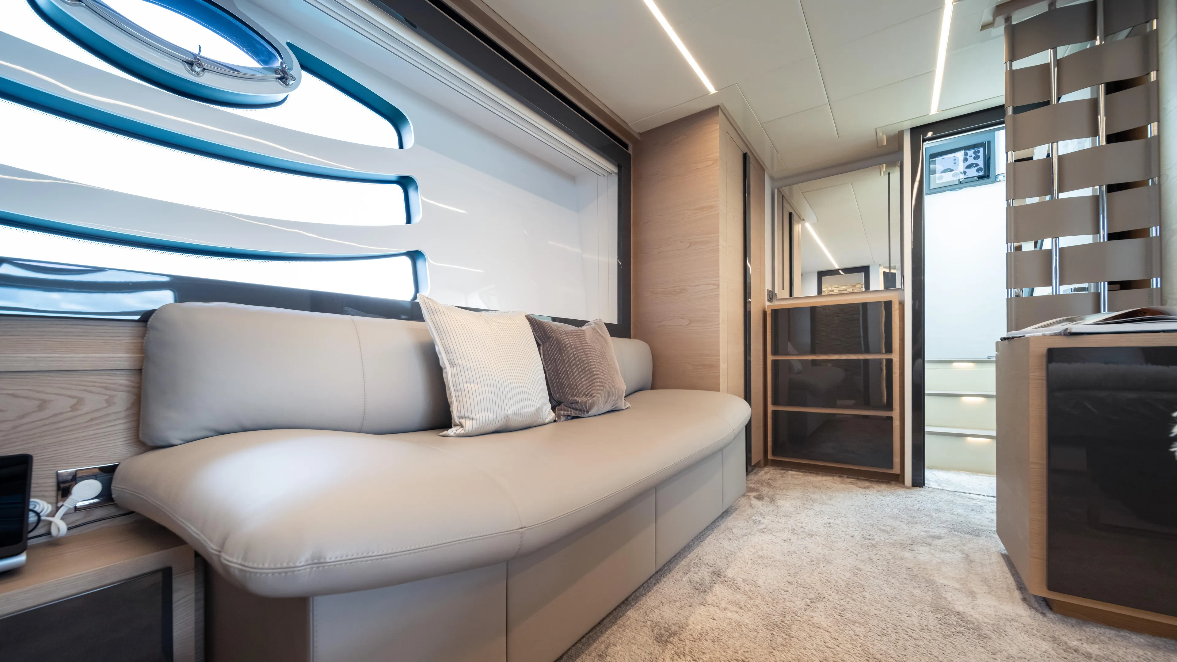 "liquid" Yacht Photos Pics Luxurious interior of a 2020 Pershing 70 yacht with modern seating and elegant design.