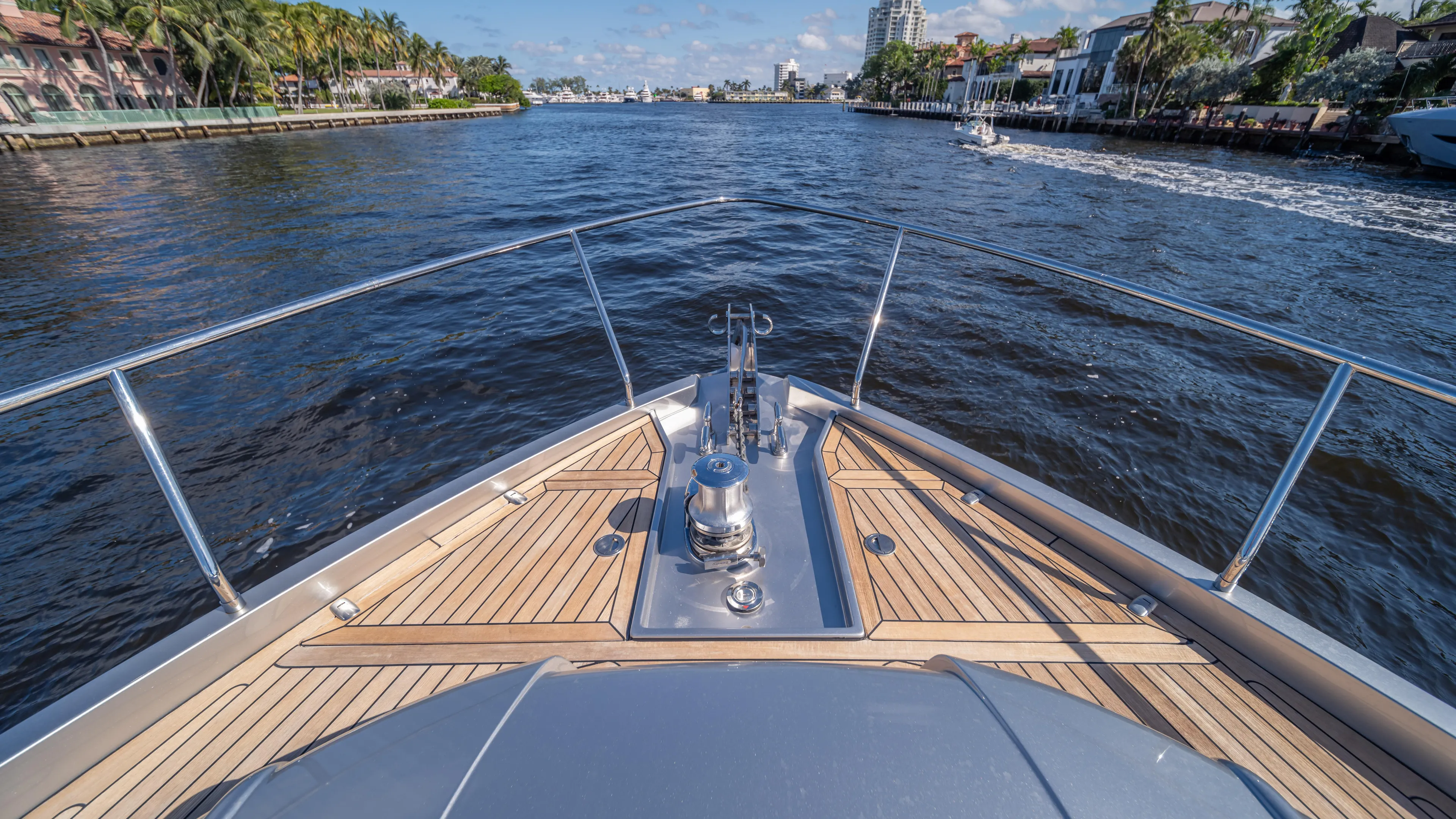 "liquid" Yacht Photos Pics Bow view of 2020 Pershing 70 yacht cruising on a scenic waterway.