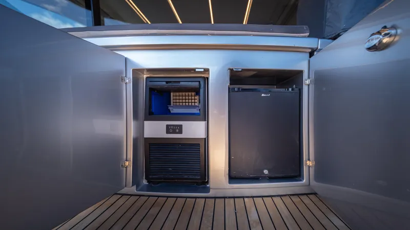 "liquid" Yacht Photos Pics Luxury yacht Pershing 70 (2020) interior with built-in appliances on wooden deck.