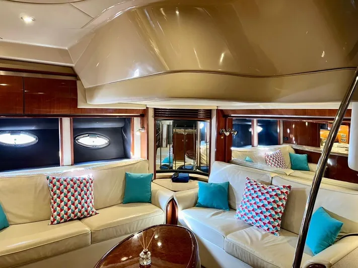  Yacht Photos Pics Luxurious interior of 2004 Sea Ray 500 Sundancer yacht with plush seating and stylish decor.