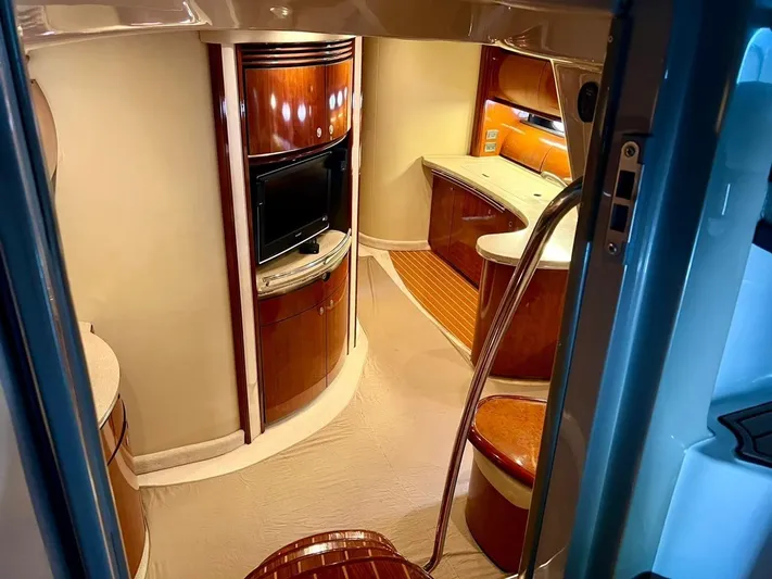  Yacht Photos Pics Interior of 2004 Sea Ray 500 Sundancer yacht with wood cabinetry and TV.