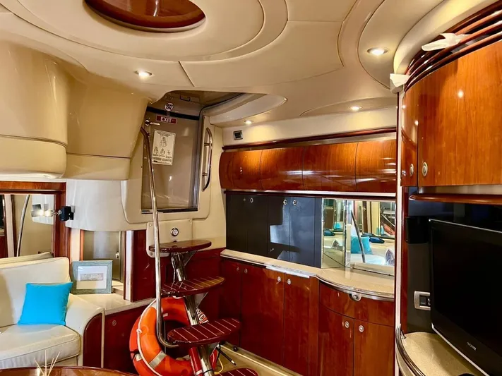  Yacht Photos Pics Luxurious interior of a 2004 Sea Ray 500 Sundancer yacht with wooden cabinetry and modern amenities.