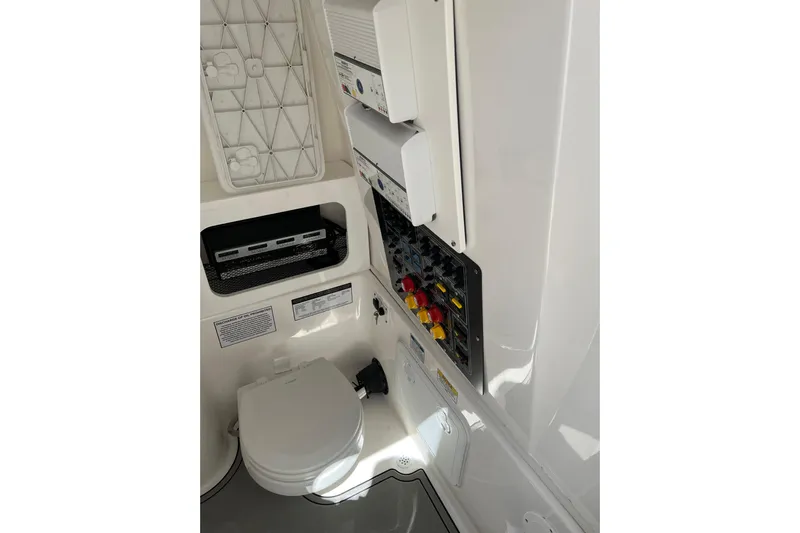 Yacht Photos Pics 2021 Sea Fox 288 Commander boat interior with toilet and control panel.