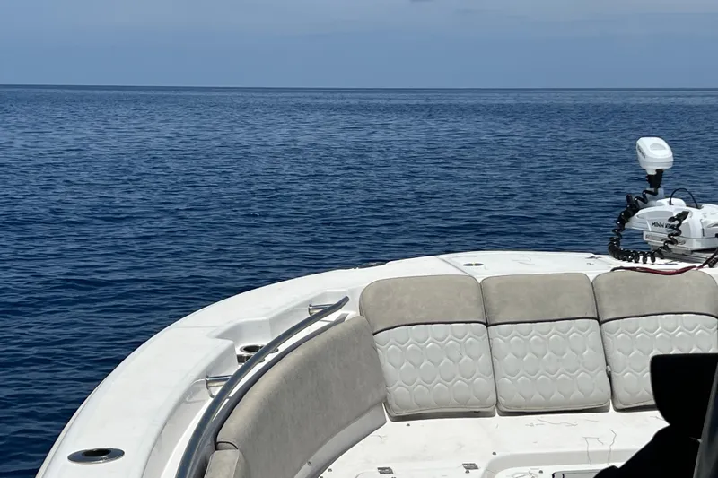  Yacht Photos Pics Sea Fox 288 Commander boat, 2021 model, with cushioned seating, on calm ocean waters.