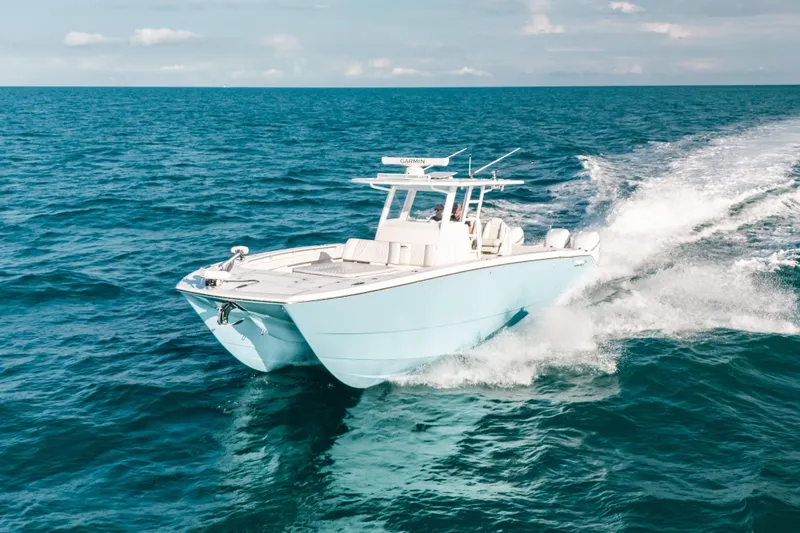  Yacht Photos Pics Invincible 37 Catamaran 2021 cruising on open ocean waters.
