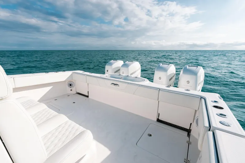  Yacht Photos Pics Invincible 37 Catamaran 2021 on open sea, showcasing spacious deck and powerful engines.